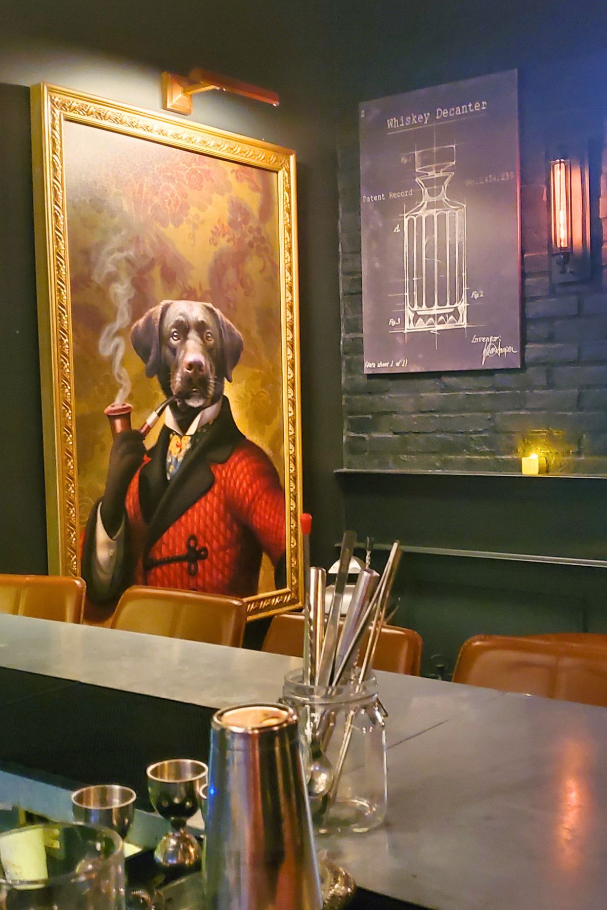 framed picture of a dog smoking a pipe with a red and black suit jacket inside the Speakeasy