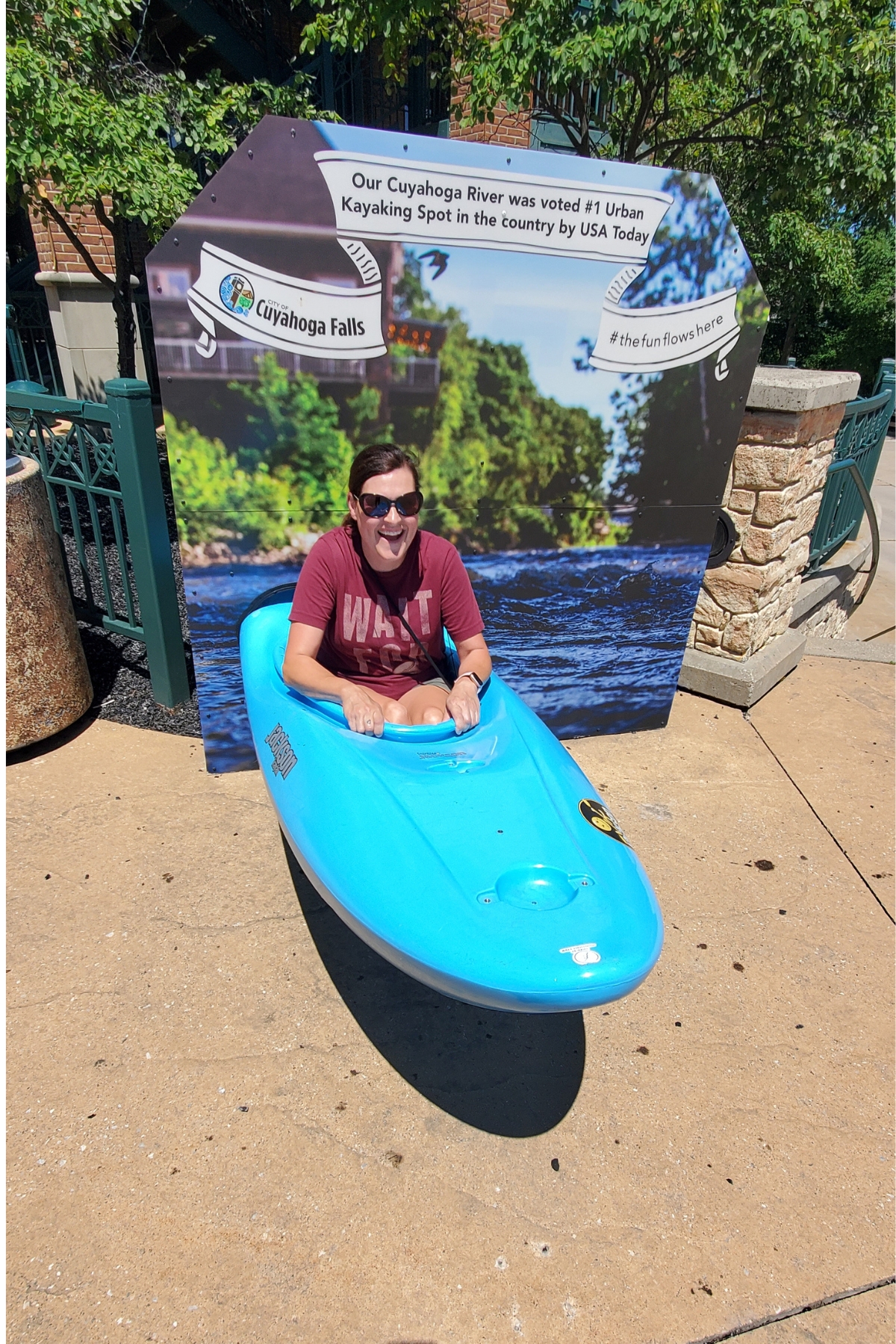 girl sitting inside a kayak for a fun photo opp outside